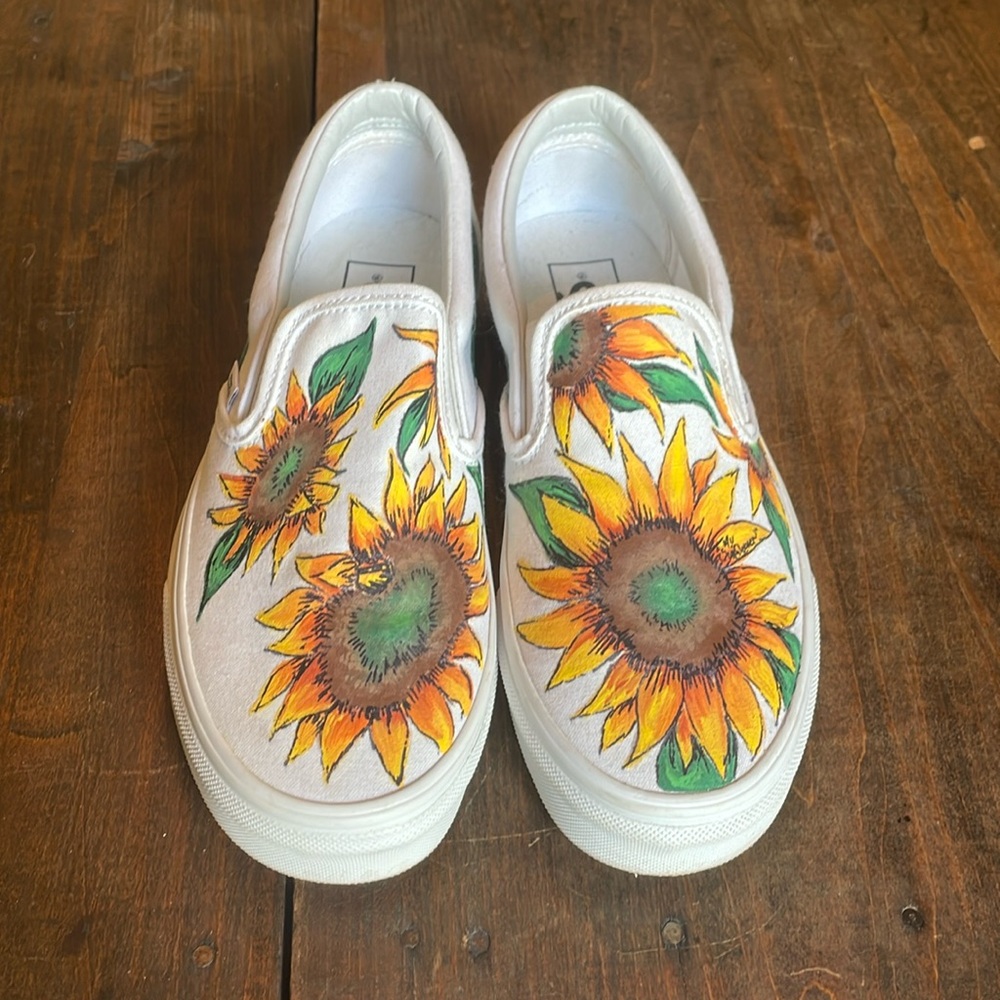 White vans with sunflowers